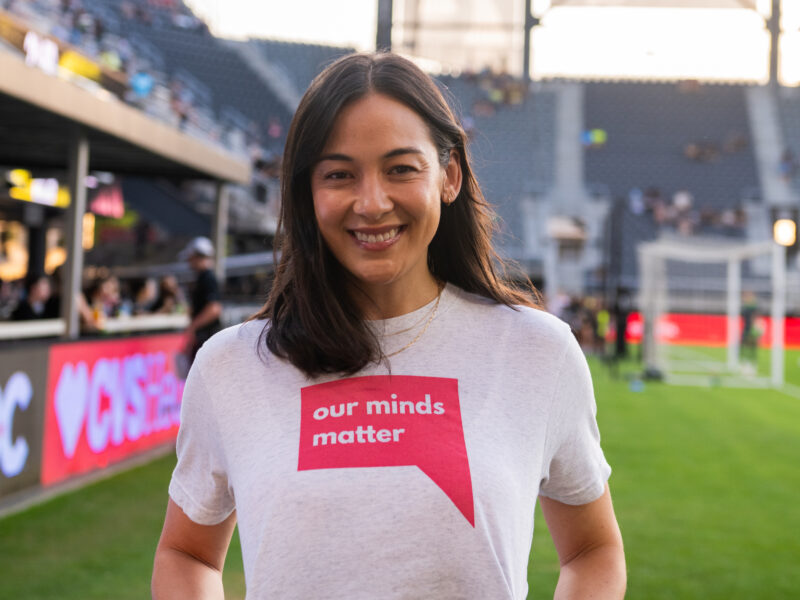 A photo of Lauren Anderson wearing an Our Minds Matter t-shirt